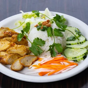 a plate of food with rice and vegetables