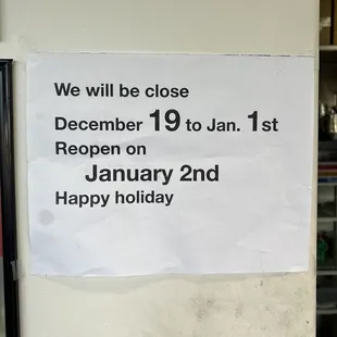 a sign posted on a refrigerator