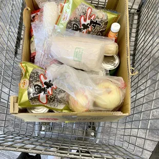 a shopping cart full of groceries