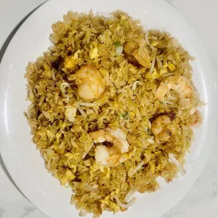 a plate of fried rice with shrimp