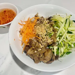 a plate of food with meat and vegetables