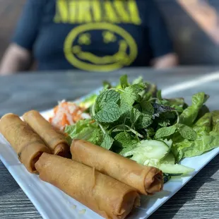 Pork and shrimp egg rolls, herbs, pickled veggies (daikon, carrots)
