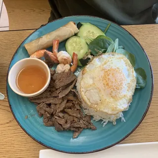 C2. Grill Prawns, BBQ Beef & Eggrolls Over Fried Egg Plate