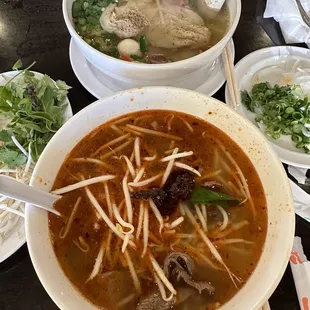 a bowl of soup and a bowl of noodles