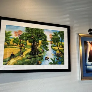 a painting of a river and a painting of a woman