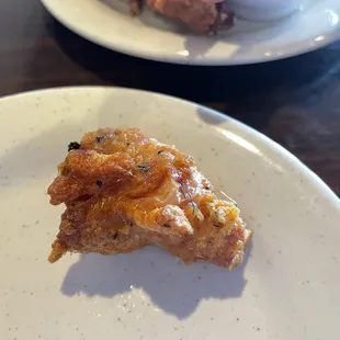 Fried chicken wing with metal wire in it