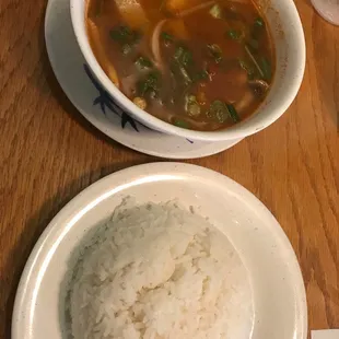 Tom yum soup appetizer with a side of white rice