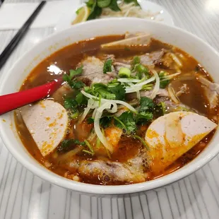 a bowl of soup with meat and vegetables