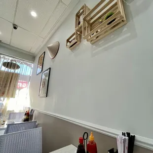 a dining area with a table and chairs