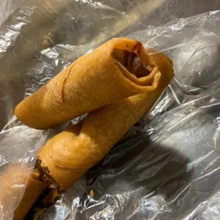 two pieces of food wrapped in foil