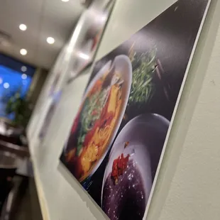 a picture of food displayed on a wall