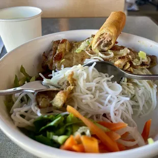 My favorite meal here!!!! Took a bite for you to see the handmade fried egg roll center. Vietnam house is the best!!