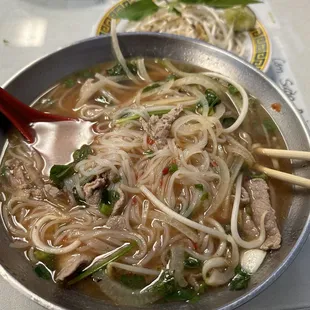 B1. Pho Tai : Beef Pho with onions, rice noodles, sliced beef, green onions, mint and cilantro