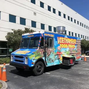 food truck parked in front of a building