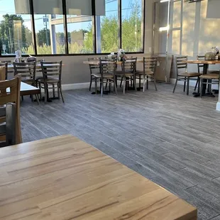 a dining area with tables and chairs
