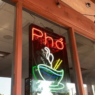 a neon sign of a bowl of soup