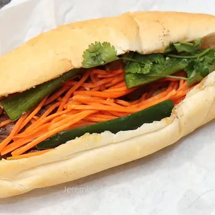 a sandwich with carrots and lettuce