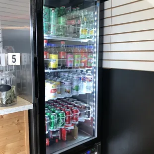 a refrigerator with drinks in it