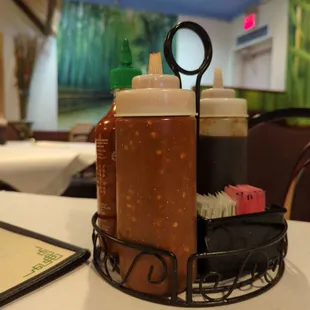 a table with condiments and condiments