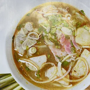 a bowl of soup with meat and vegetables