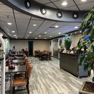 a dining area with tables and chairs