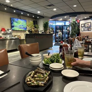 Nice, clean interior of restaurant near front left side of restaurant.  We just got our appetizer and drinks.