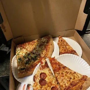 two slices of pizza in a box