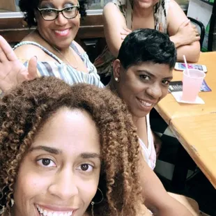 a group of women sitting at a table