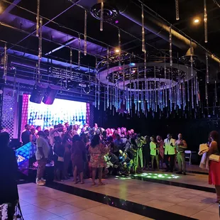 a large group of people dancing