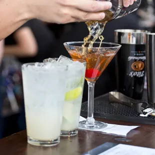 a bartender pouring a drink