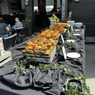 Buffet brunch of breakfast sandwiches, French toast, fresh pastries, and Maple Chickey Biscuits.