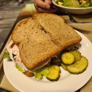 a sandwich and a salad on a plate