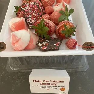 a platter of strawberries and chocolate covered strawberries