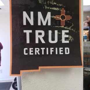 a sign that says nm true certified