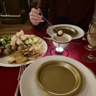 a plate of food and a glass of wine