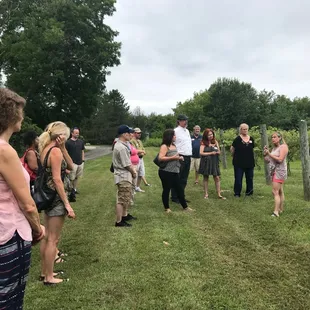 a group of people standing in a field