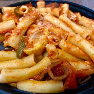Penne pasta bowl with arrabiata sauce and sautéed vegetables