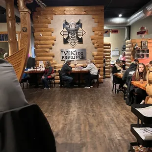 people sitting at tables and eating