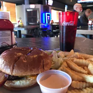a burger and fries on a plate
