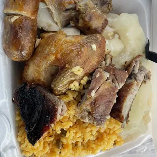 a tray of food with rice and meat