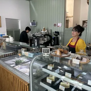 Manager and staff working on orders.