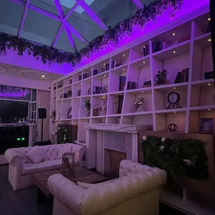 a living room with purple lighting