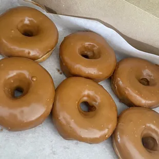 Fresh backed risen donuts  Cookie butter topping