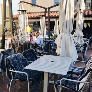outdoor dining area with tables and chairs