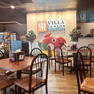 a dining area with tables and chairs