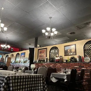 a dining room with tables and chairs