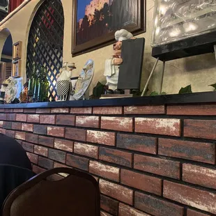 a man in a chef&apos;s hat sitting at a table