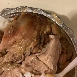 a plate of meat and rice