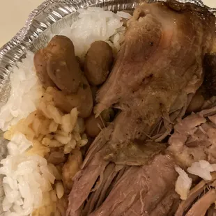 a plate of meat and rice