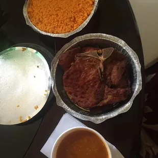 Fried pork chops, yellow rice and beans